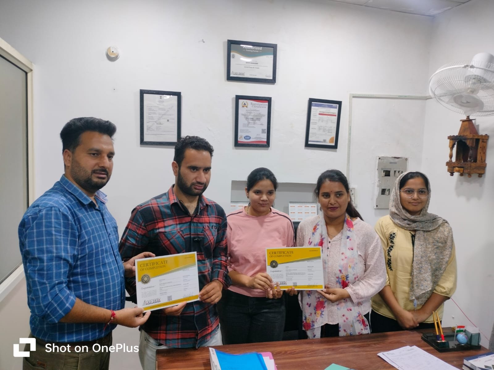 Students receiving ISO certified course certificates at SKYSYS