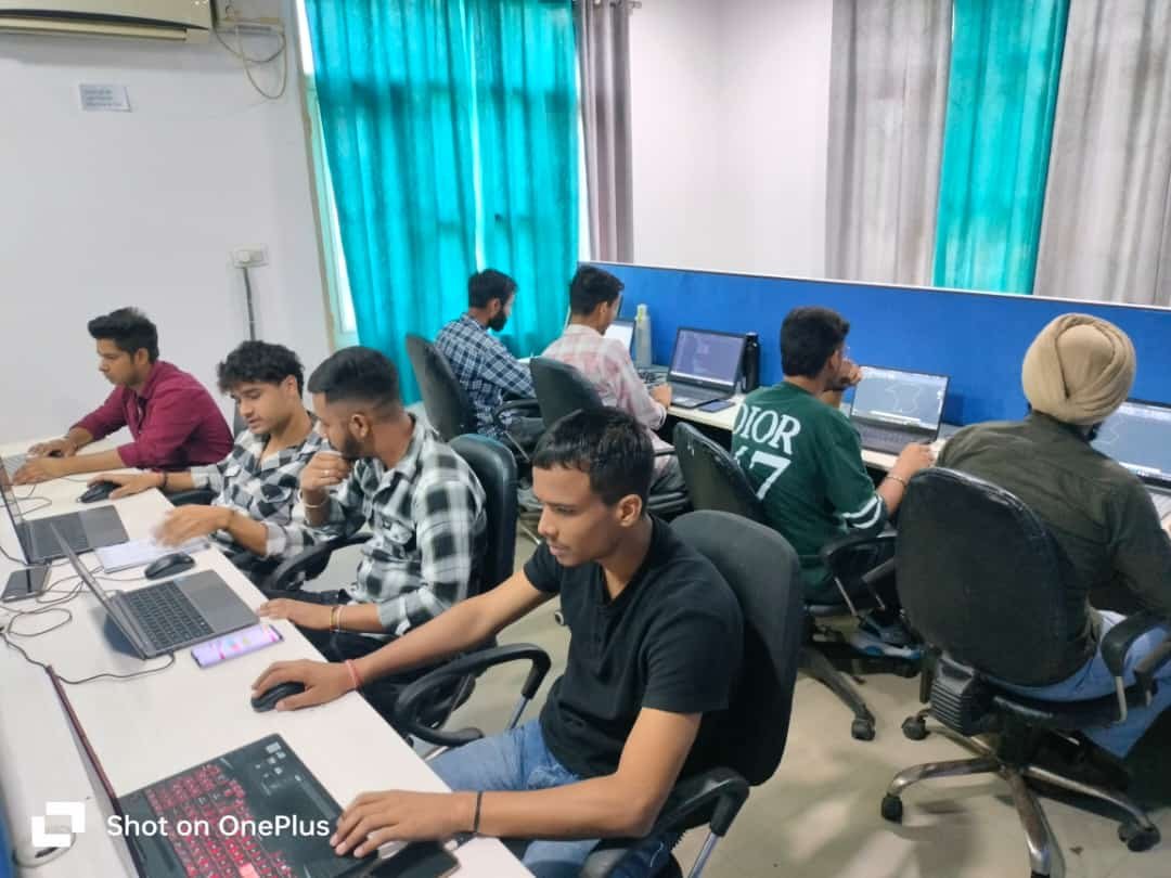 Students practicing 3D CAD modeling on individual workstations